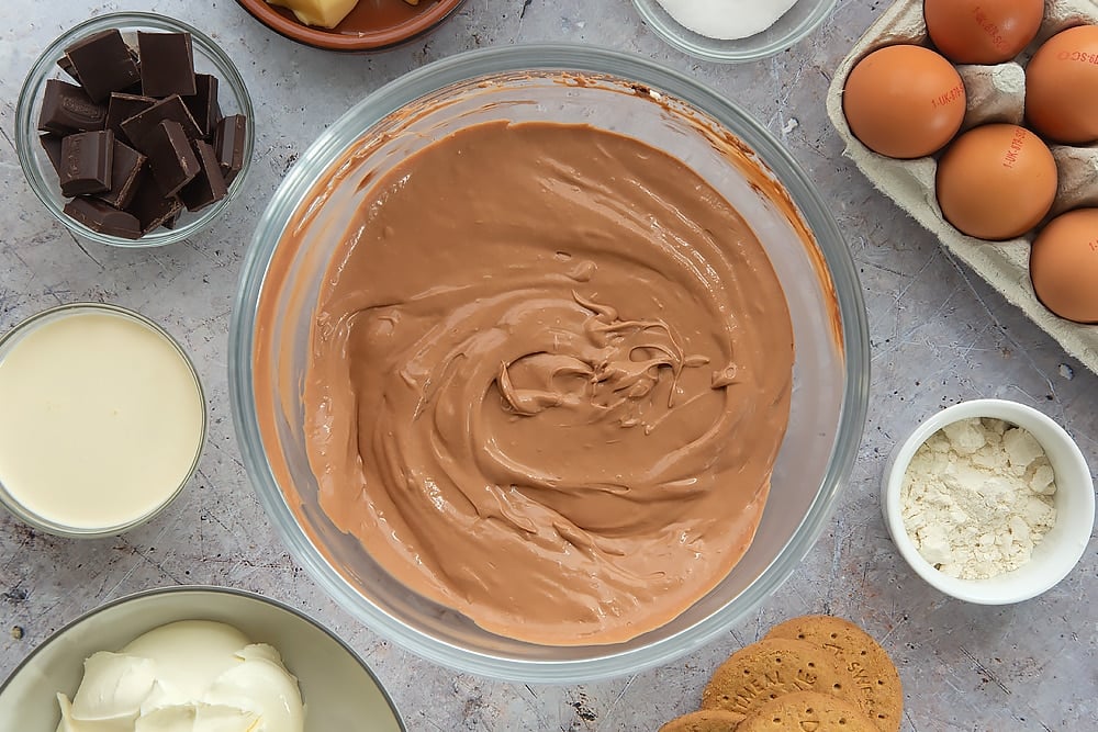 Overhead shot of beating in the eggs to the mixture. 