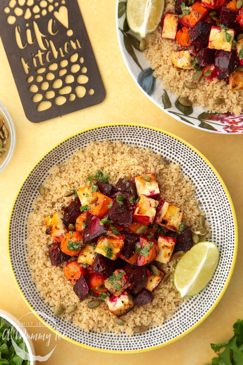 An overhead shot of a decoative plate filled with Beetroot and feta salad with couscous.