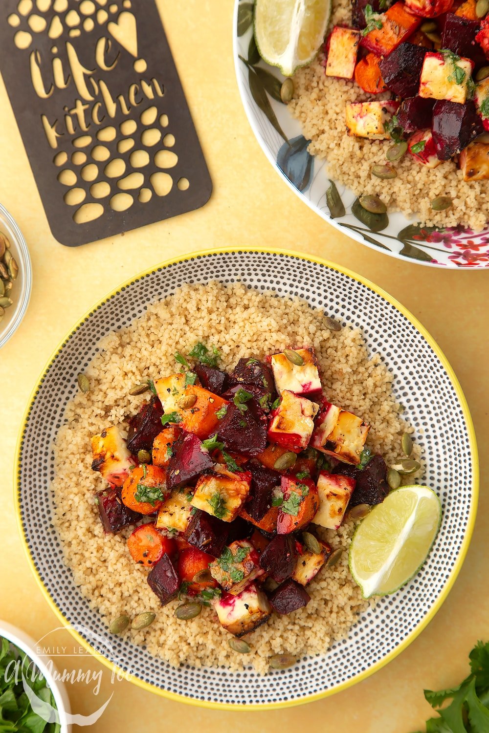 An overhead shot of a decoative plate filled with Beetroot and feta salad with couscous. 