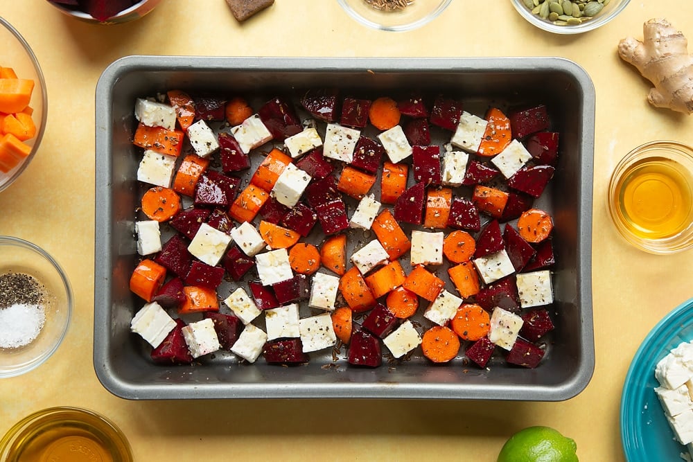 Overhead shot of the Beetroot and feta salad with couscous inside a pan having been drizzled with honey. 