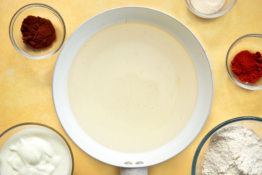 Oil in a deep pan, ready to fry the buttermilk chicken.