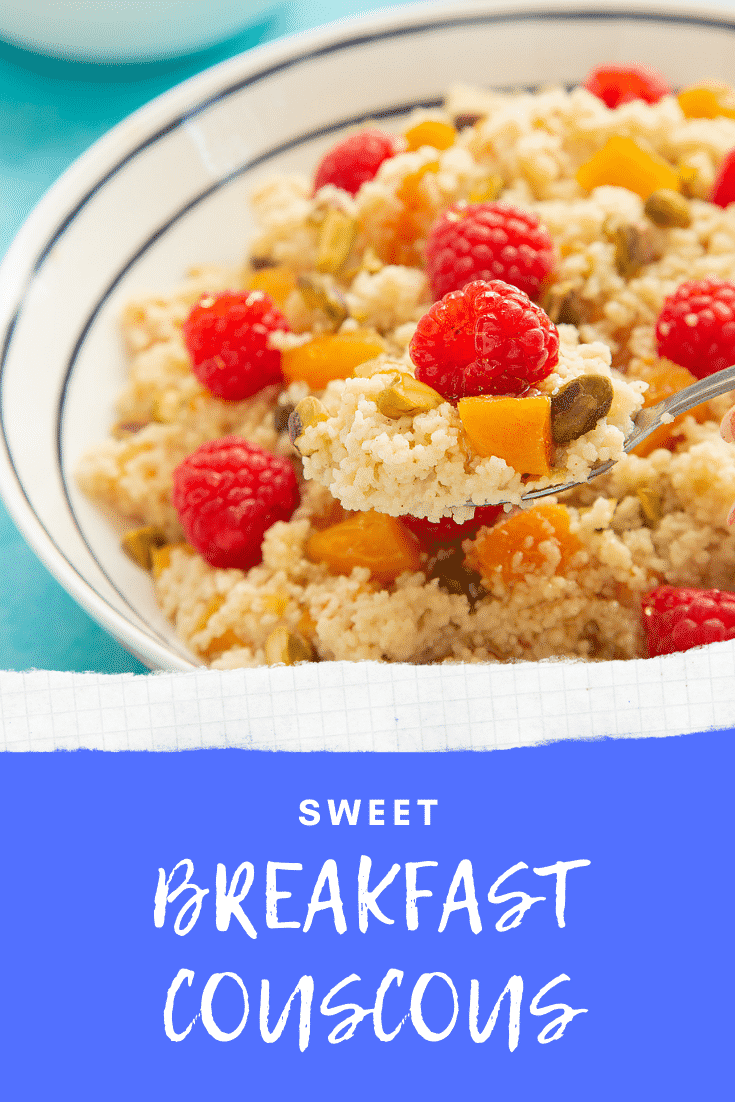 Close up shot of a spoon in a bowl of sweet breakfast couscous. At the bottom of the image there's some text describing the image for Pinterest. 