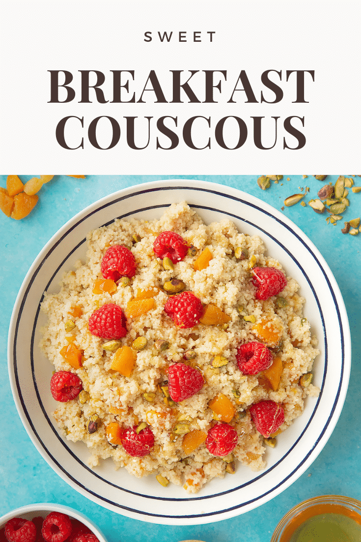 Overhead shot of the sweet breakfast couscous on a blue background. At the top of the image there's some text describing the image for Pinterest.