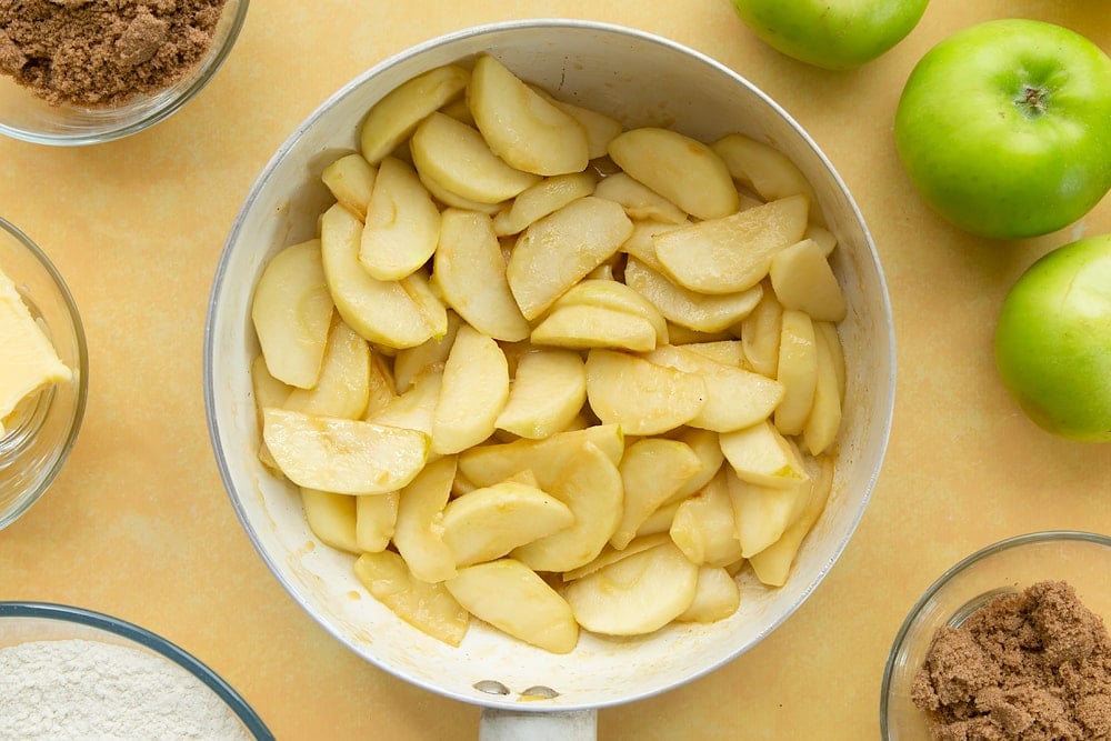 Overhead shot of the apples having been cooked in the pan for 5 minutes. 