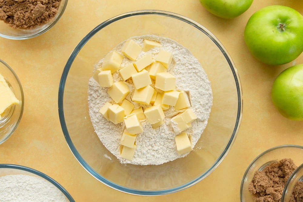 Overhead shot of the butter and flour in a bowl to make the topping for the toffee apple crumble. 