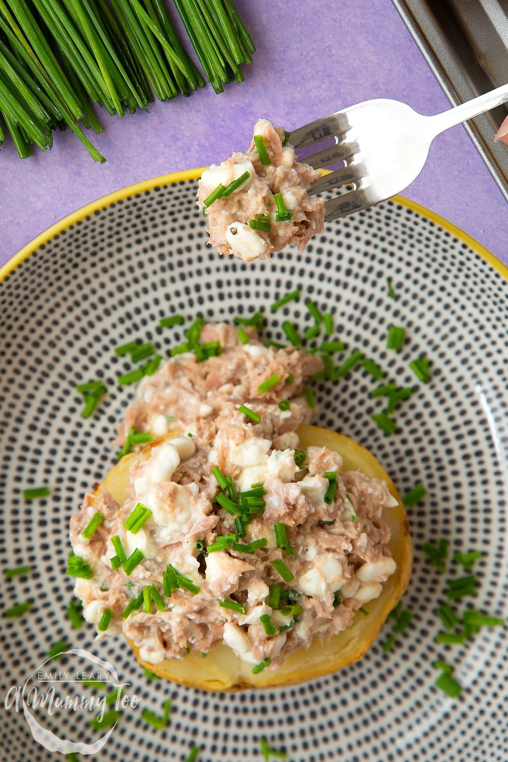 Overhead view of the low-fat tuna cheese jacket potato ready to be eaten. 