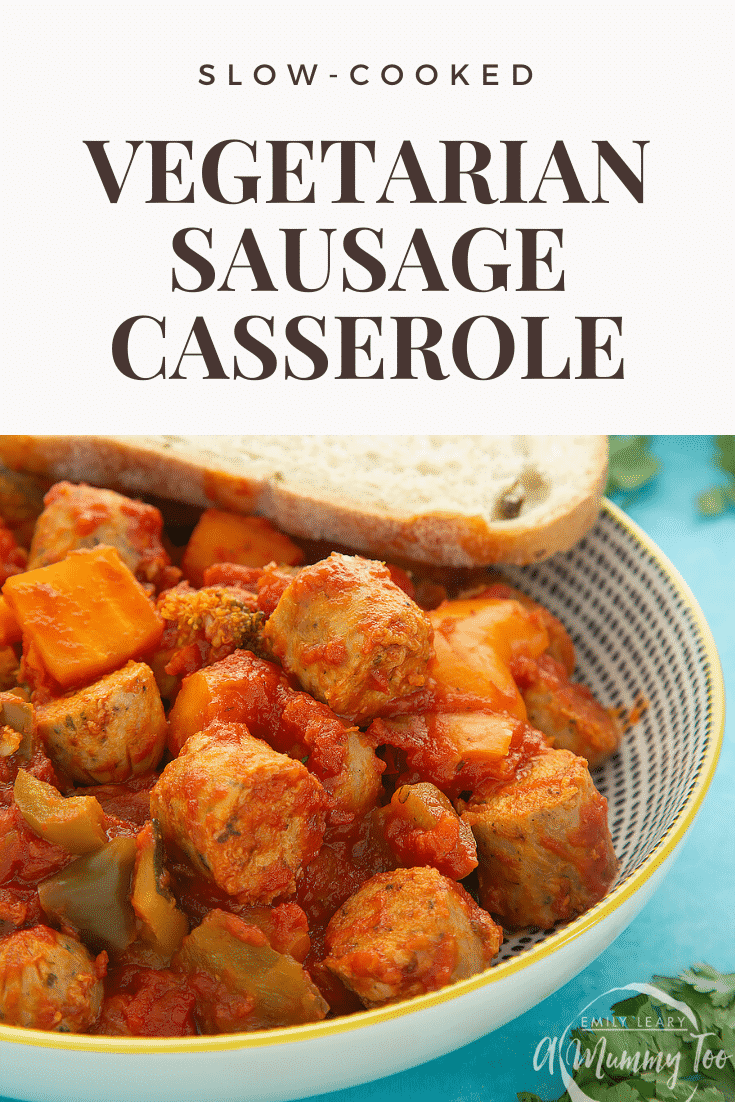 Close up shot of the Slow-cooked vegetarian sausage casserole in a decorative bowl on a blue table. At the top of the image there's some brown text on a white background describing the image for Pinterest. 