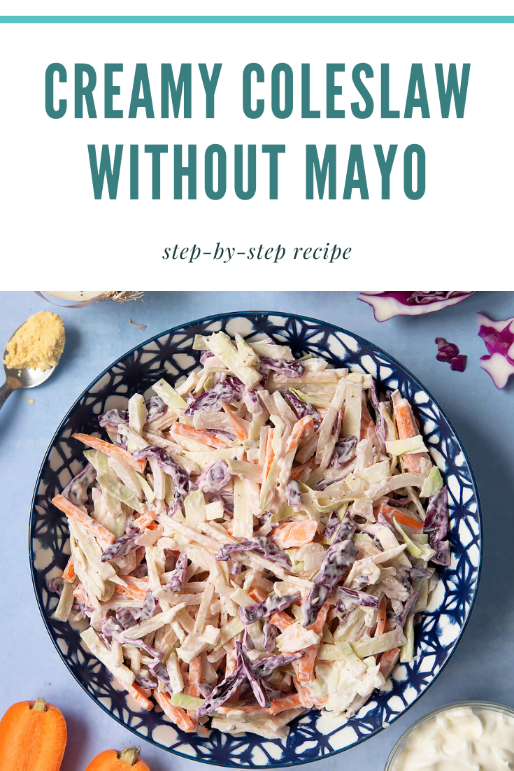 Creamy coleslaw without mayo served in a bowl. The bowl is surrounded by vegetables and creme fraiche. Caption reads: creamy coleslaw without mayo step-by-step recipe