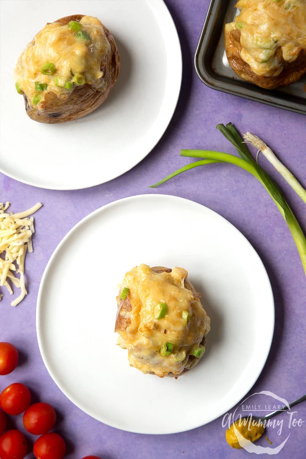 A cheese and onion jacket potato served on a white plate.