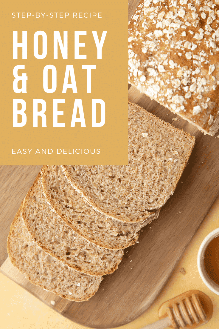 Honey and oat bread sliced on a chopping board with some text describing the image at the side. 