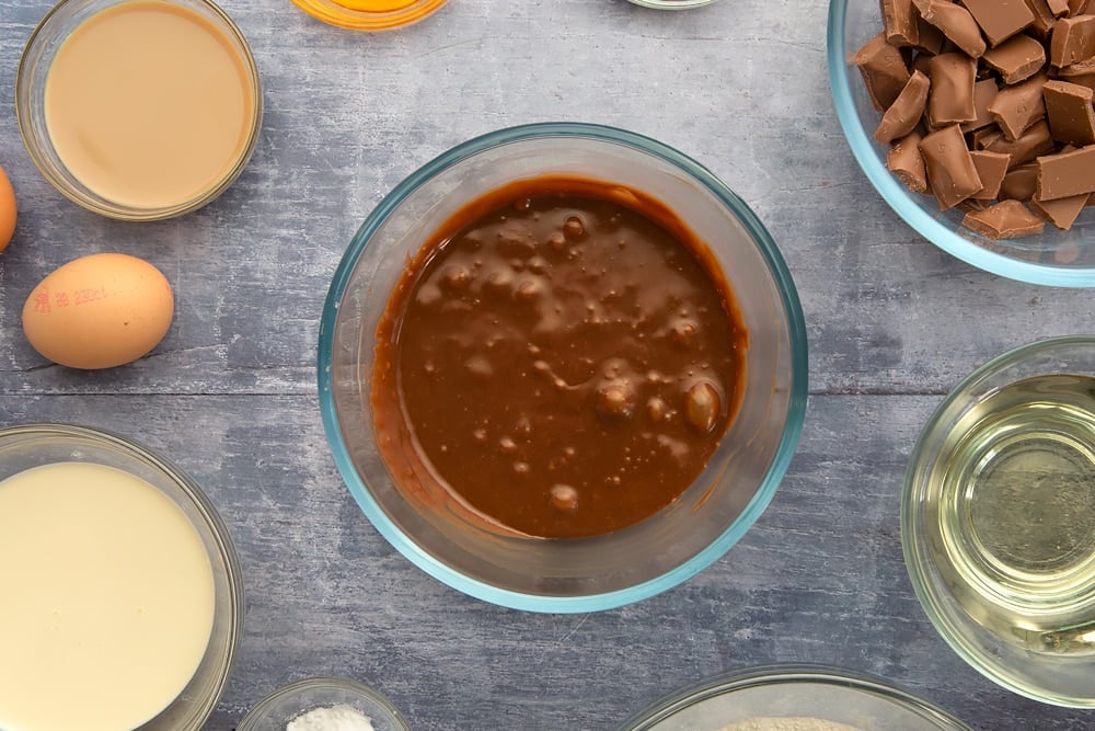 Melted galaxy chocolate ganche to be served with the galaxy chocolate cake