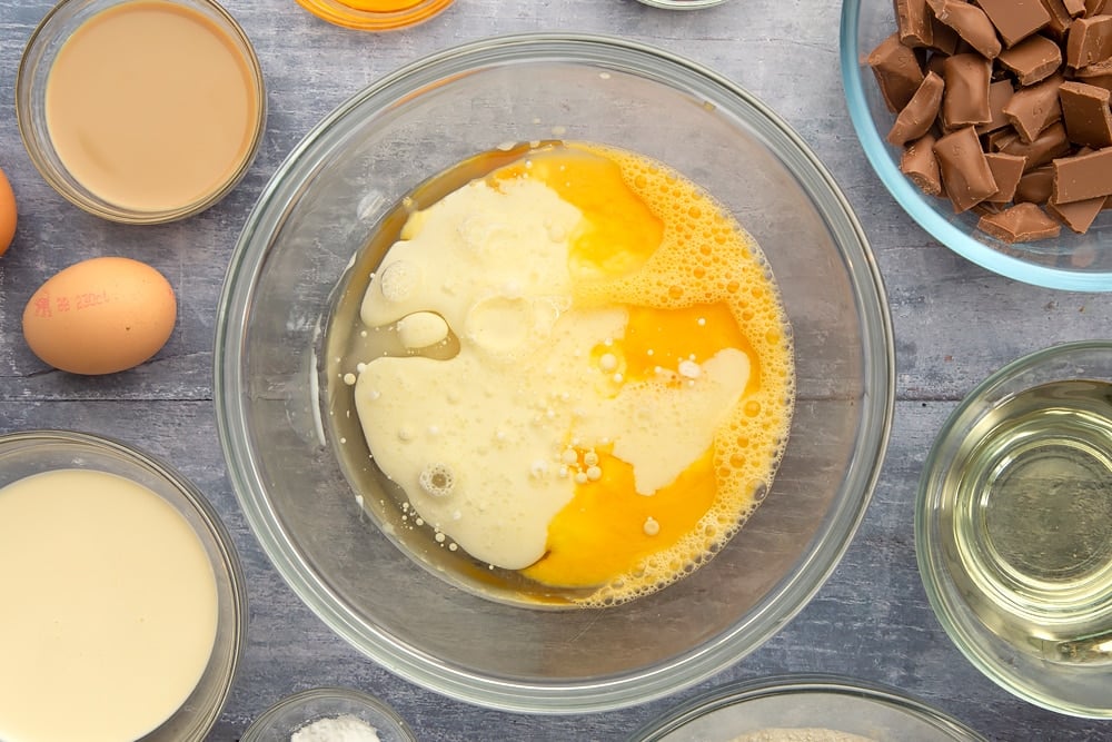 Adding the oil and golden syrup to the galaxy chocolate cake mix. 