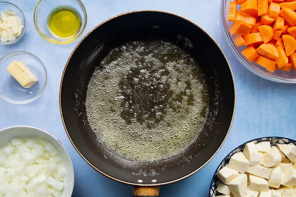 A pan with some oil after being cooked on medium heat for a couple of minutes.