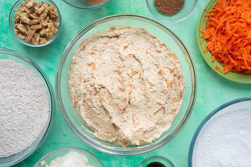 The carrot cake tray bake mixture once the carrot has been mixed  in the mixing bowl.