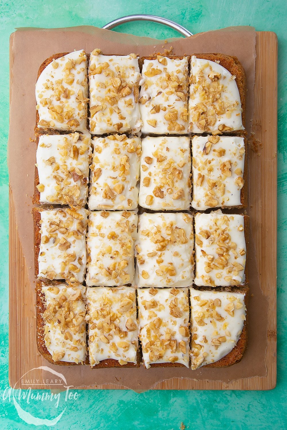 The carrot cake tray bake which has been cut into servings. 