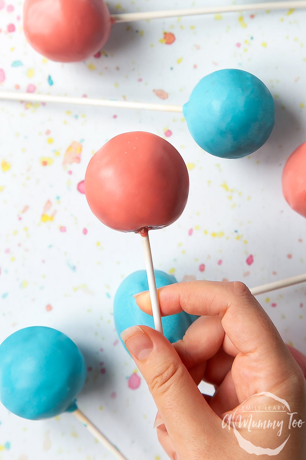 One of the finished coral pink chocolate cake pops