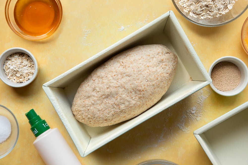 Overhead shot of dough in a loaf tin