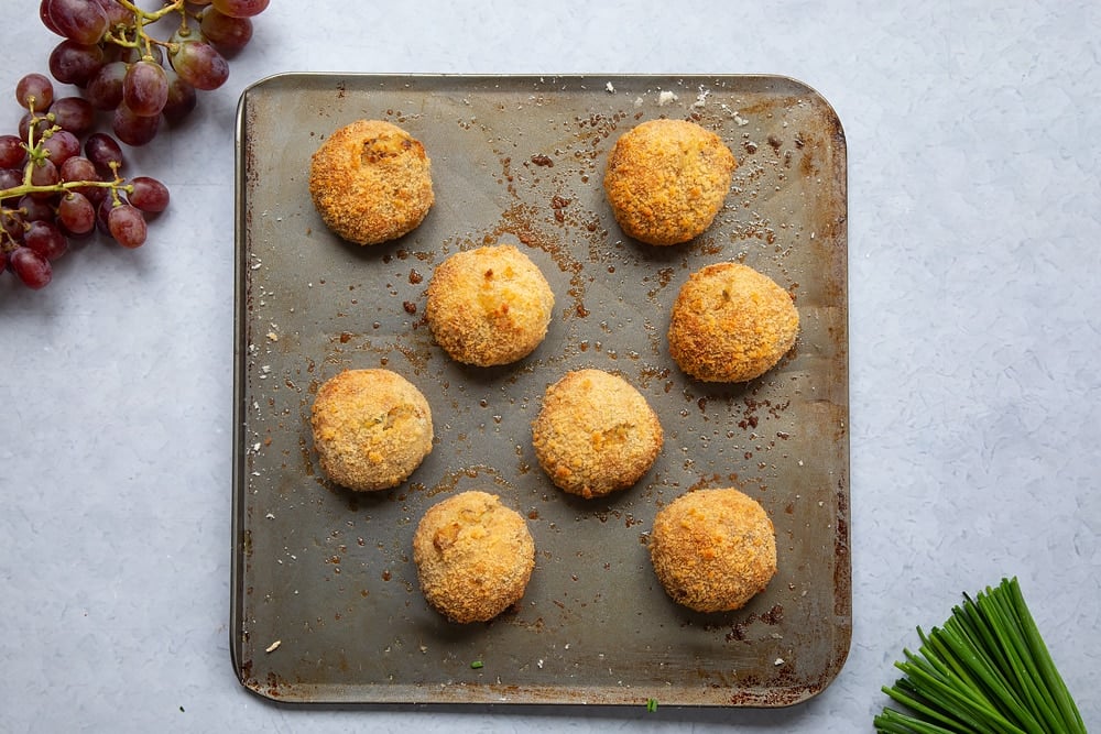 The 8 mackerel fish cakes on the baking tray after being baked in the oven.