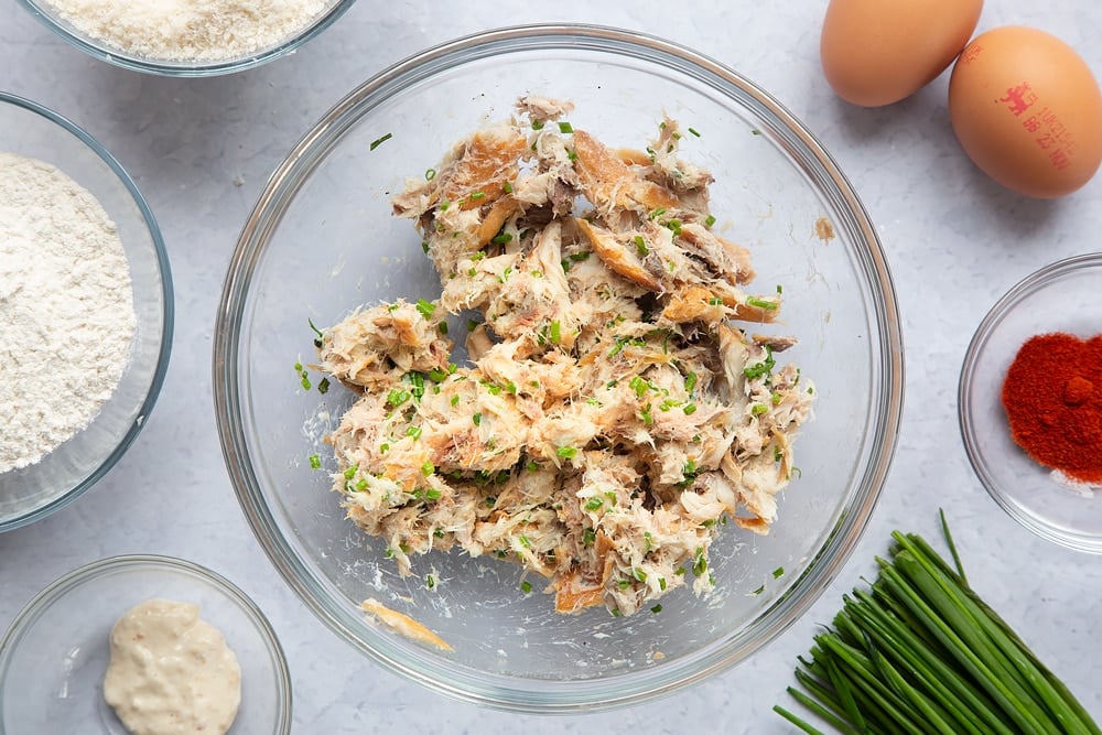 A mixed bowl of horseradish, chives, salt, pepper and mackerel.