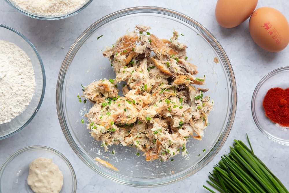 A mixed bowl of horseradish, chives, salt, pepper and mackerel.