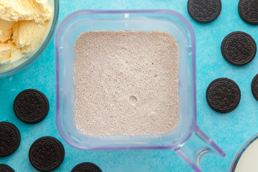 Over head shot of the blender after the oreo milkshake ingredients have been blended together.