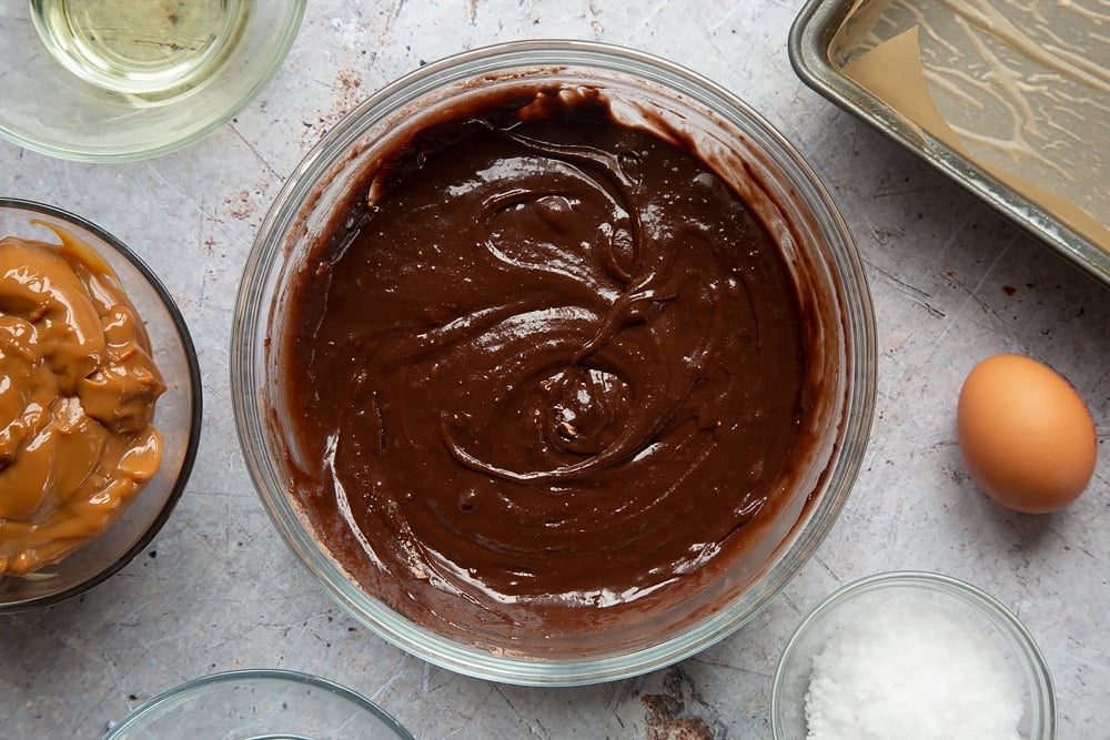 The finished gooey salted caramel brownies mixture in a bowl ready to be added to a cake tin ready for baking.