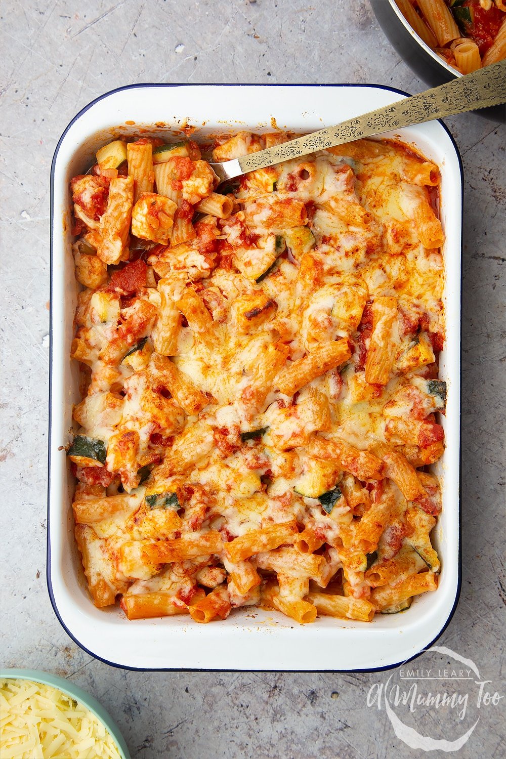 The completed halloumi pasta bake in a baking tray after being pulled out from the oven. 