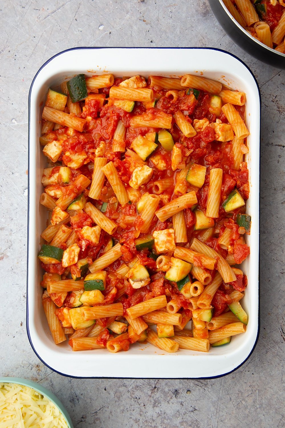 The tray of halloumi pasta bake ready to be baked in the oven.