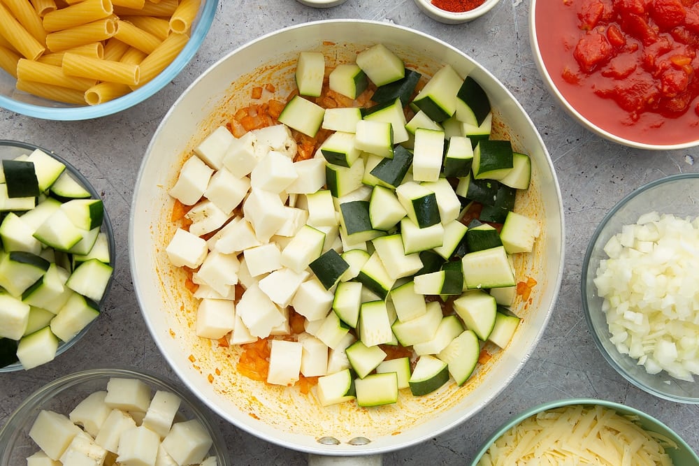 For the next stage of the halloumi pasta bake the halloumi and courgettes have been chopped and added to the pan. 