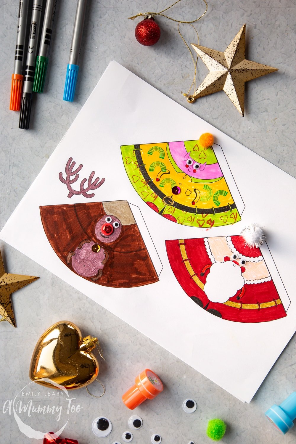 Crafty coloured in and decorated characters; elf, Santa and reindeer. 