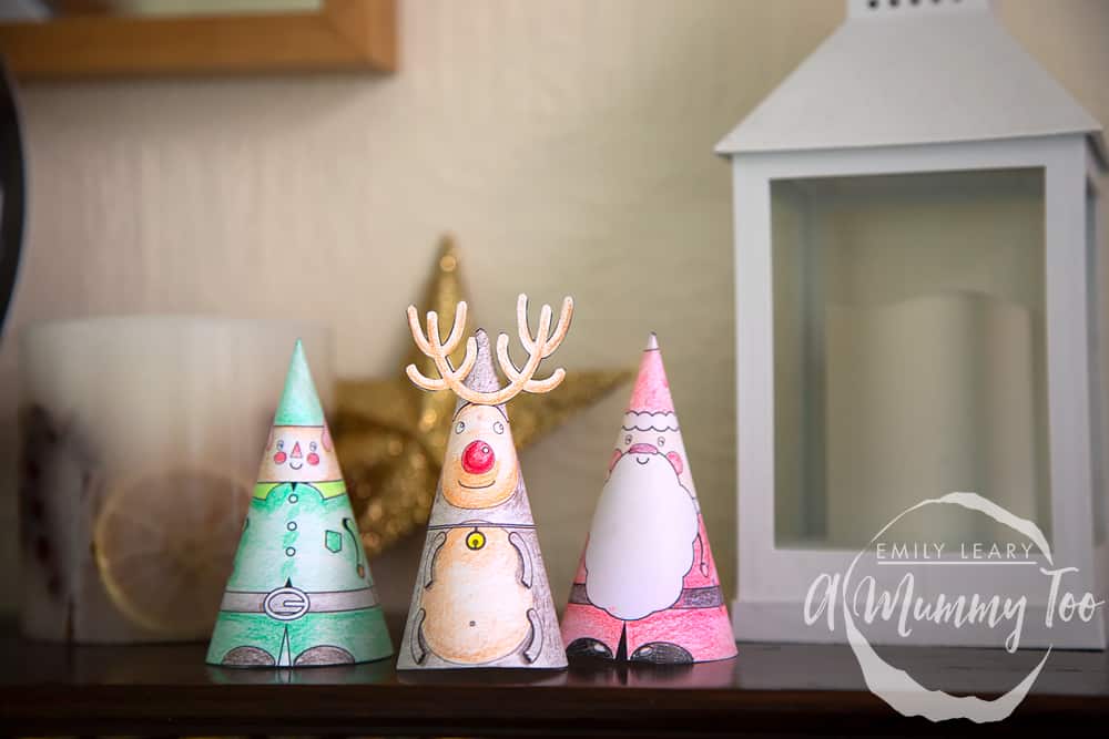 Decorated characters that can be used as mantlepiece decorations including an elf, reindeer and santa.