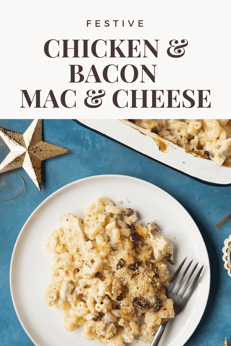 A portion of chicken and bacon mac and cheese served on a small white plate with a fork. A tray containing more of the pasta is shown to one side. Caption reads: festive chicken & bacon mac & cheese