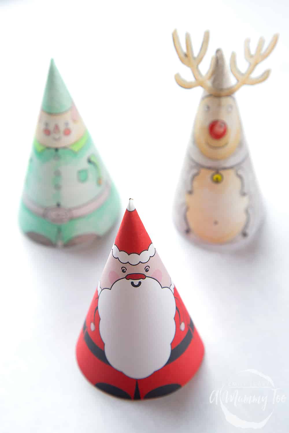 printable 3D Christmas decorations of an elf, reindeer and santa.