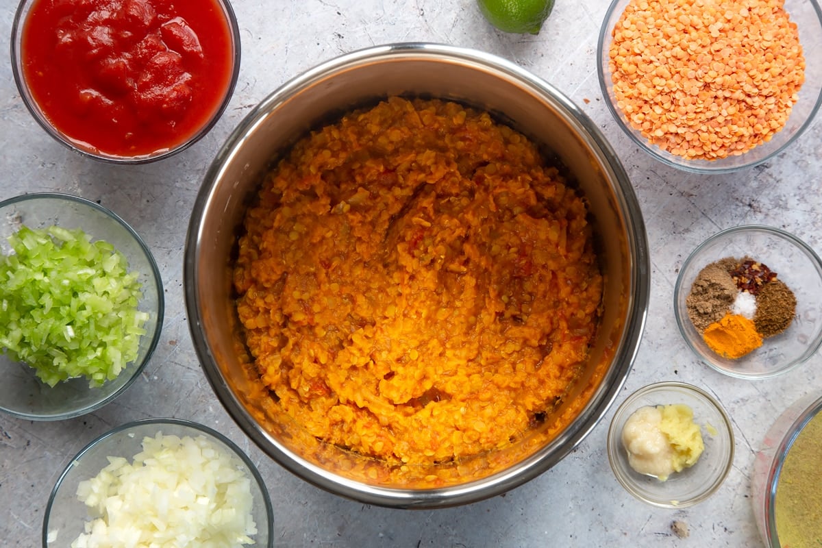 Overhead shot of low fat lentil curry ingredients in slow cooker bowl