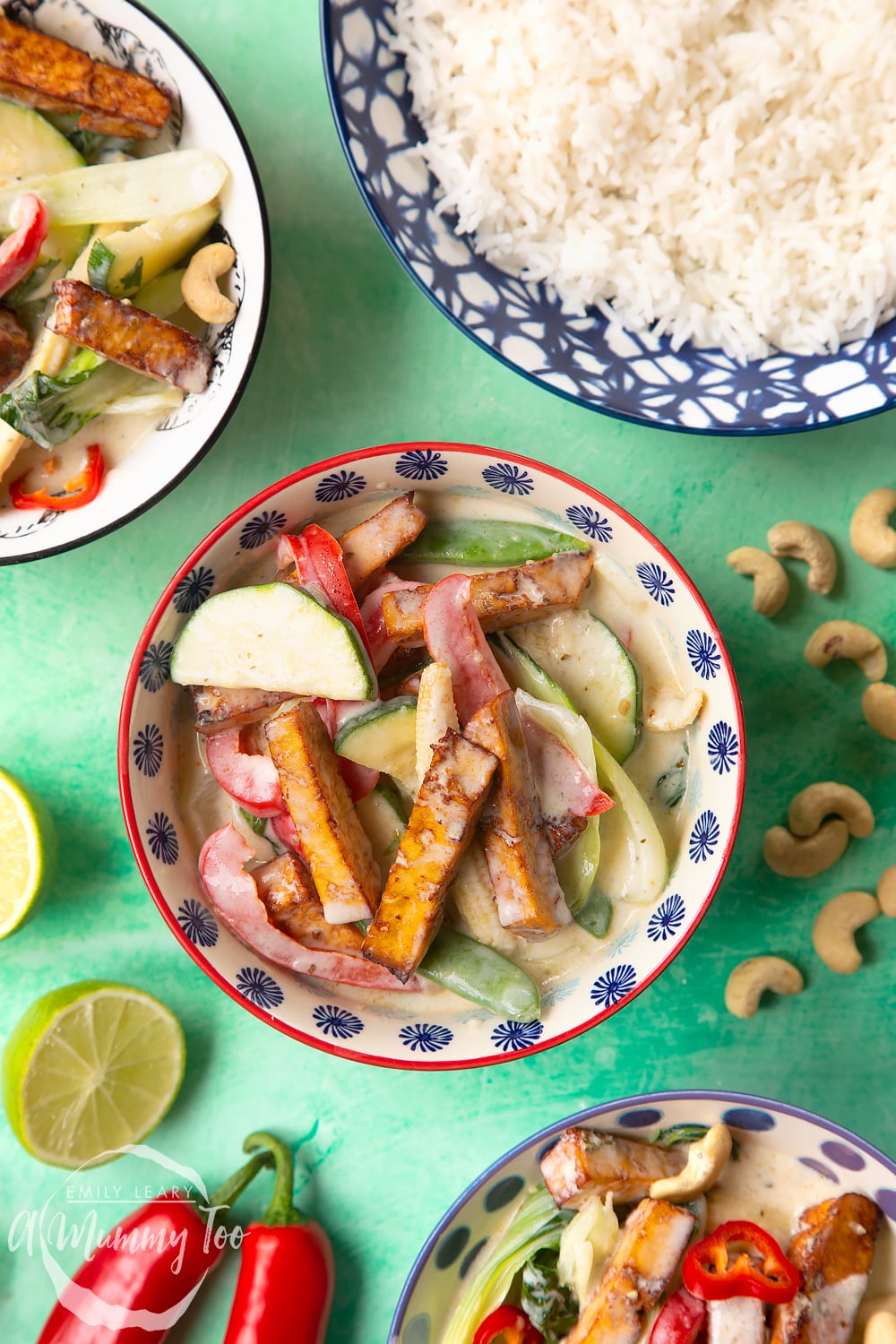 thai green curry in a small decorative bowl on a green background