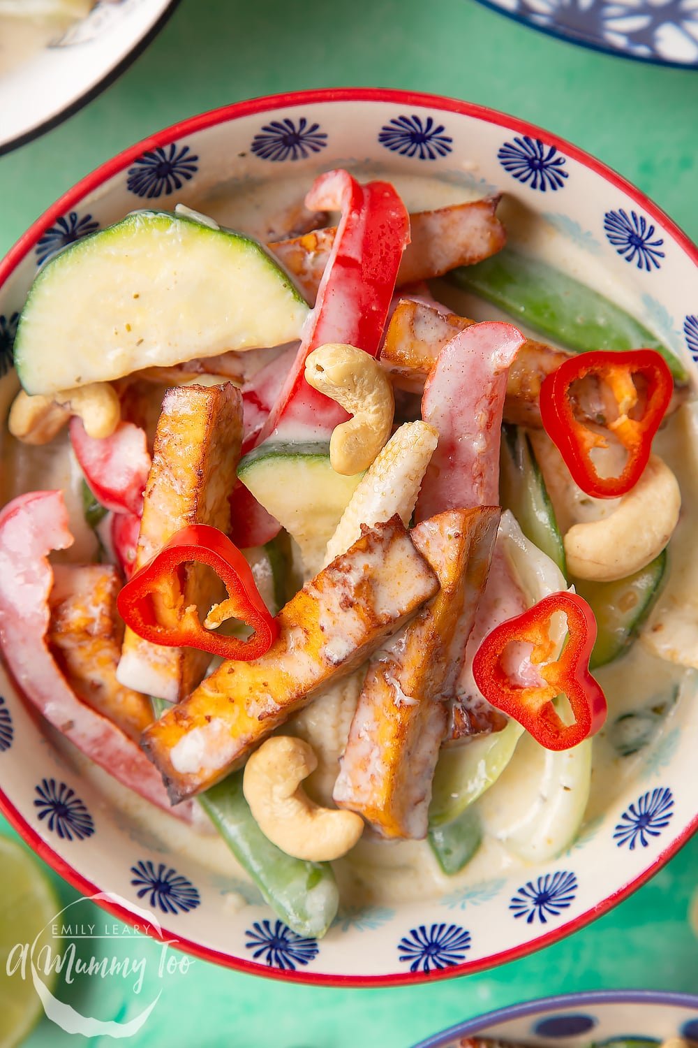 a close up view of a Thai green curry in a decorative bowl.