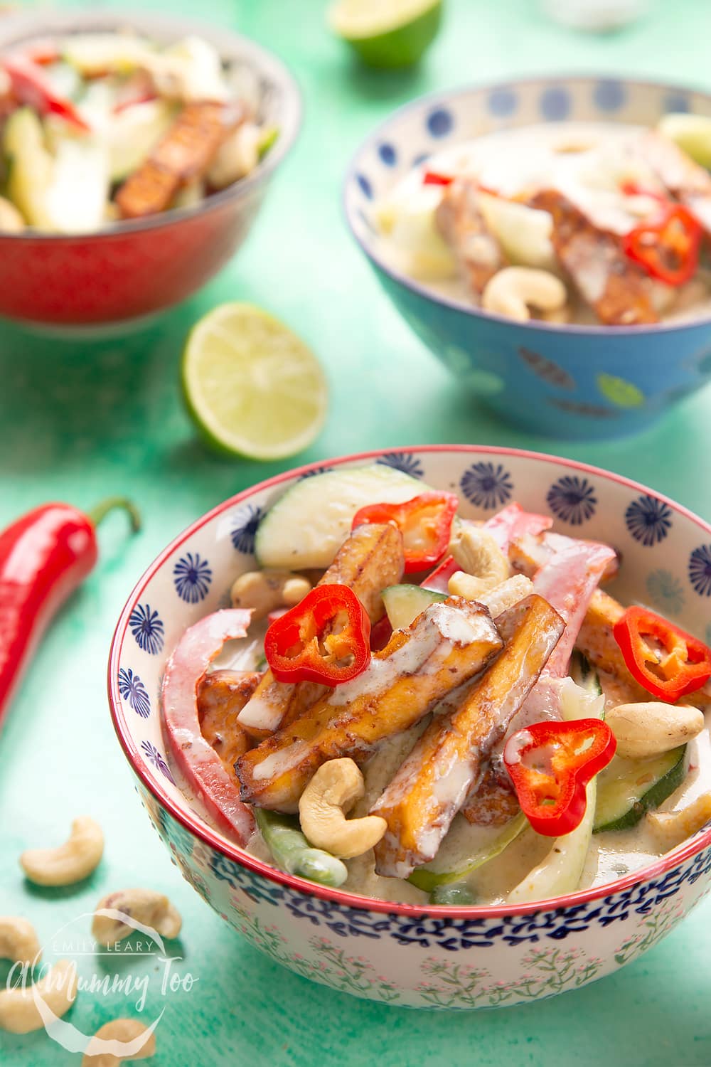 thai green curry in a small decorative bowl on a green background