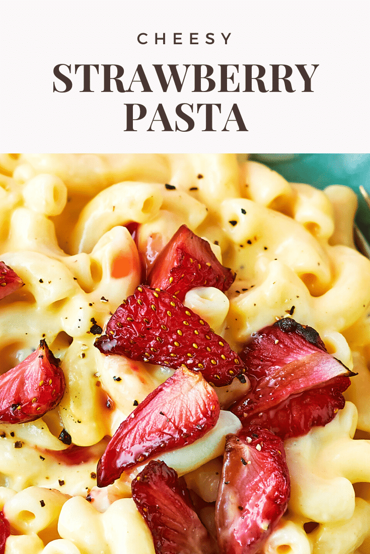 A bowl of strawberry pasta: macaroni in a cheese and butternut squash sauce, topped with roasted balsamic strawberries. Caption reads: cheesy strawberry pasta