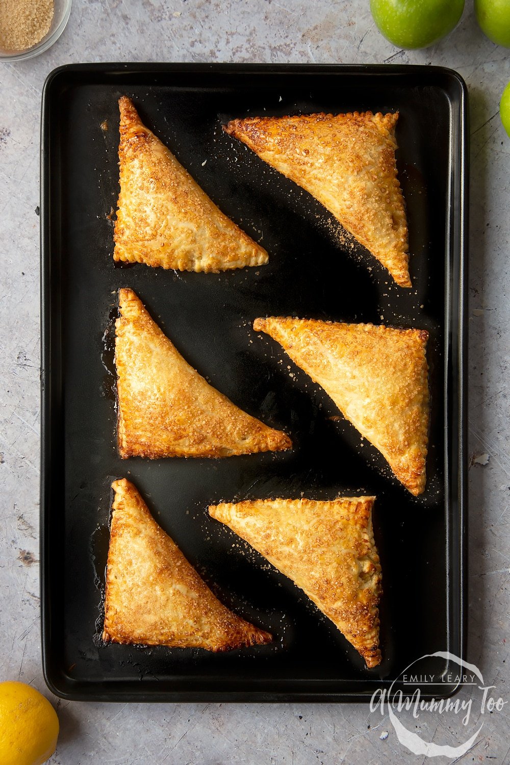 Overhead shot of the apple turnovers having been baked in the oven.