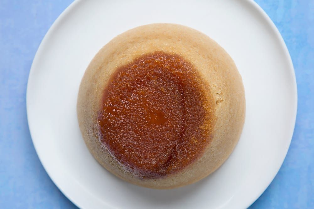 Overhead shot of sponge cake in a large bowl