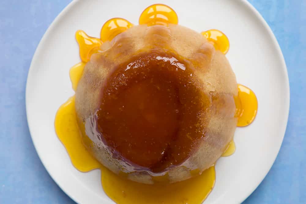 Overhead shot of pudding served in a white plate