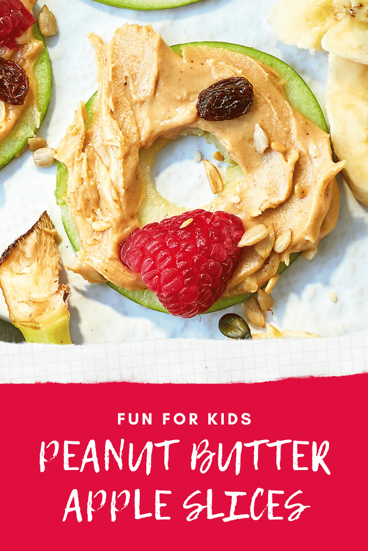 A close up of an apple slice topped with peanut butter. The caption reads: Fun for kids - peanut butter apple slices.