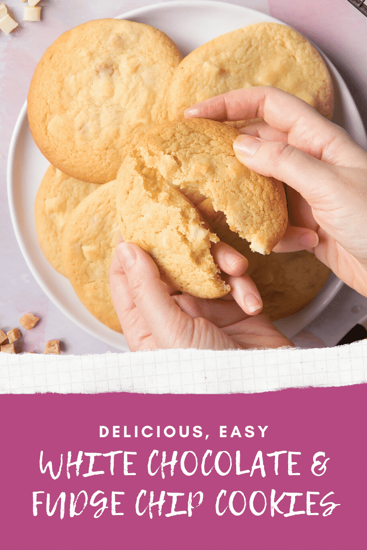 Overhead shot of a hand breaking a fudge white chocolate chip cookie open with graphic text DELICIOUS, EASY WHITE CHOCOLATE & FUDGE CHIP COOKIES below