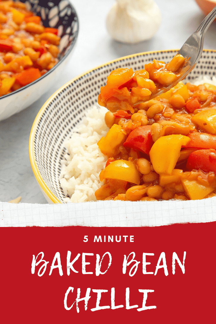 A 5 minute baked bean chilli served on a bed of rice in a bowl. A fork lifts a bite of chilli. Caption reads: 5 minute baked bean chilli.