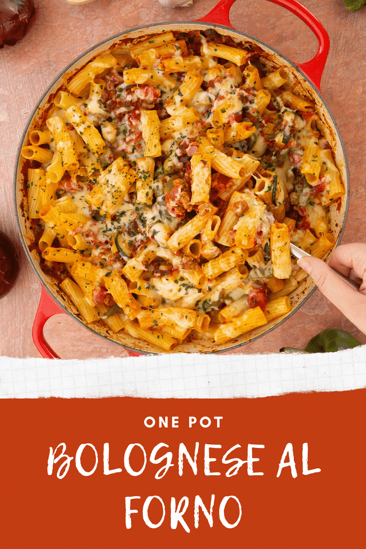 A casserole dish containing freshly baked bolognese al forno being served. Caption reads: One pot bolognese al forno