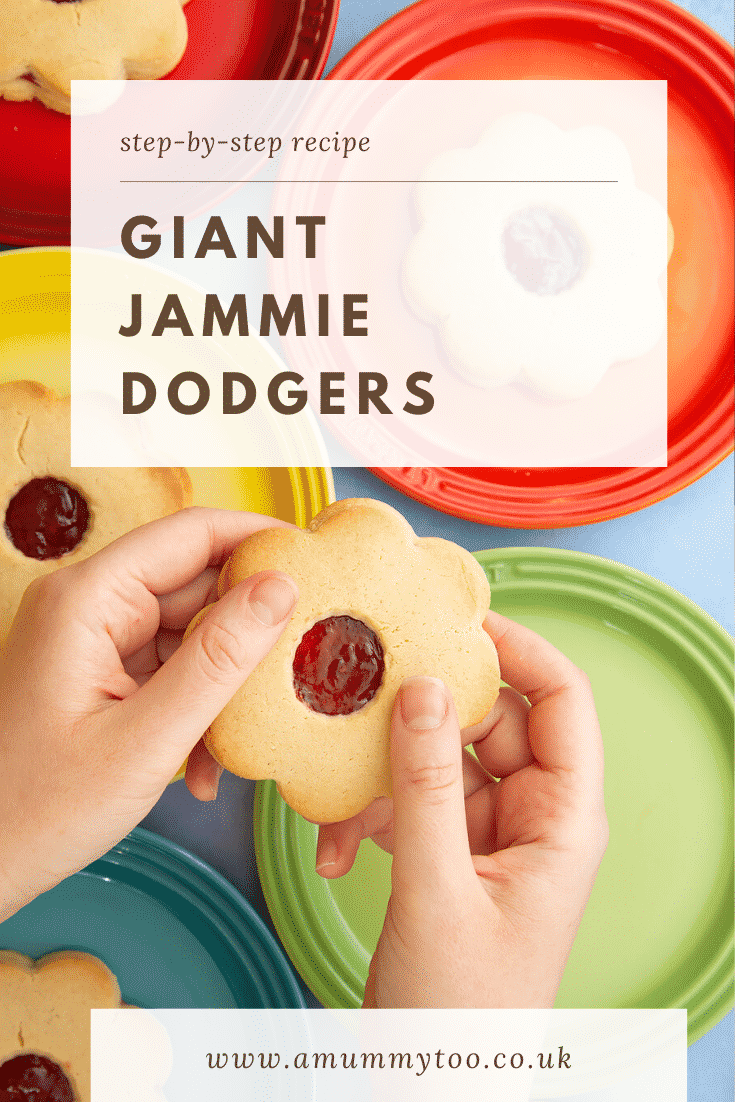 Giant jammie dodgers arranged on a variety of rainbow coloured small plates. Two hands hold one. Caption reads: step-by-step recipe giant jammie dodgers