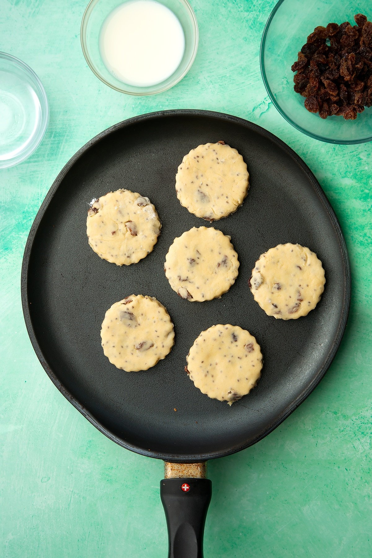 Uncooked Vegan Welsh cakes in a pan.