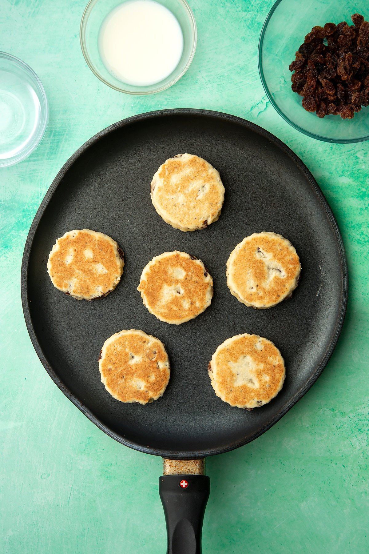 Cooked Vegan Welsh cakes in a pan.