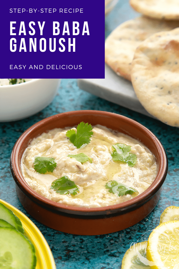 Baba ganoush in a shallow terracotta dish. Feta, cucumbers, lemon and flat bread surround the dish. Caption reads: step-by-step recipe baba ganoush easy and delicious