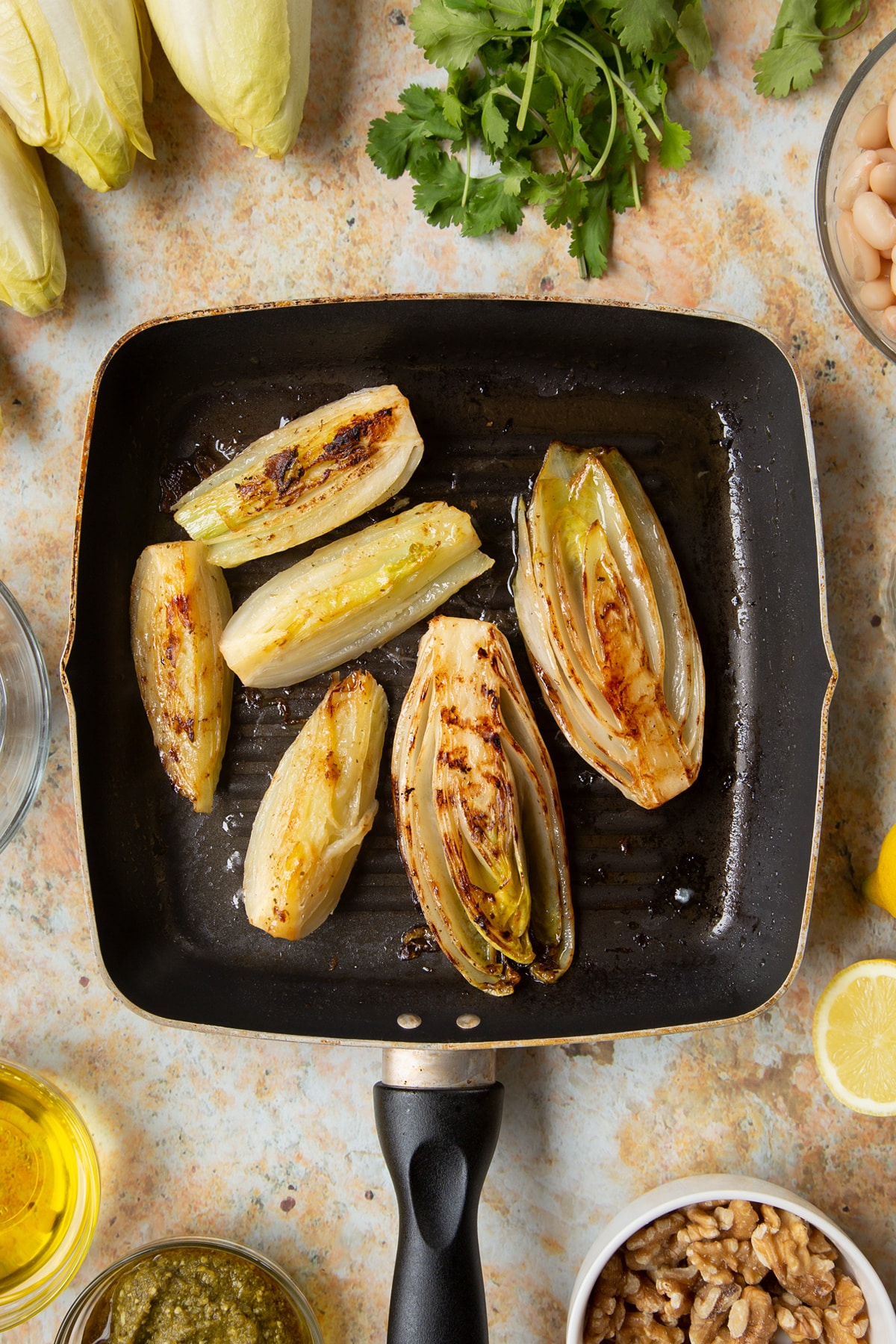 Braised chicory and fennel in a griddle pan.